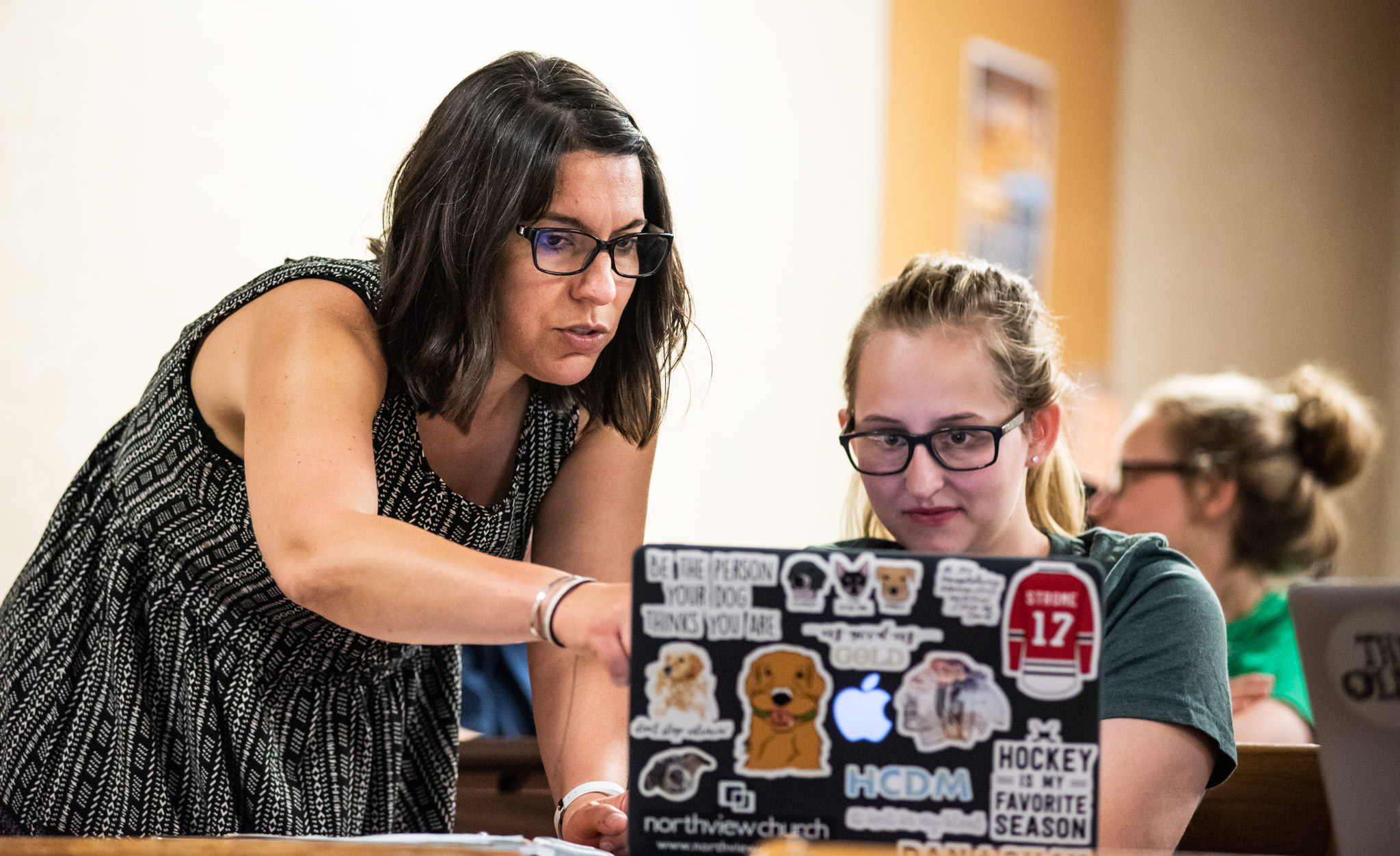 Rachel Davidson, Ph.D. Faculty member explains things to a student