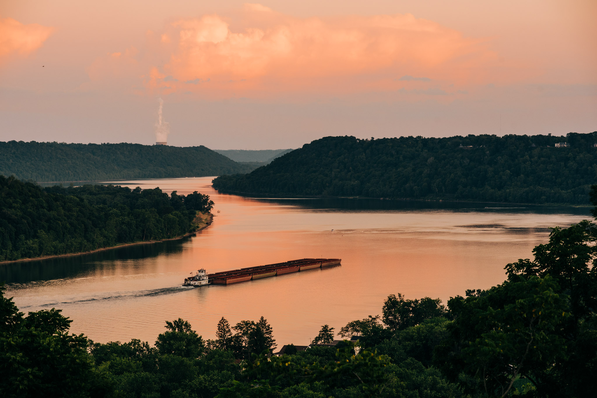 The Point at sunset with a barge on the Ohio River
