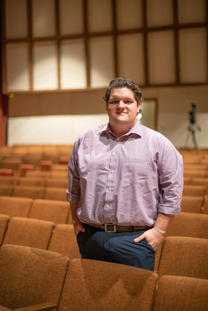 Bradley Murray stands in Fitzgibbon Recital Hall
