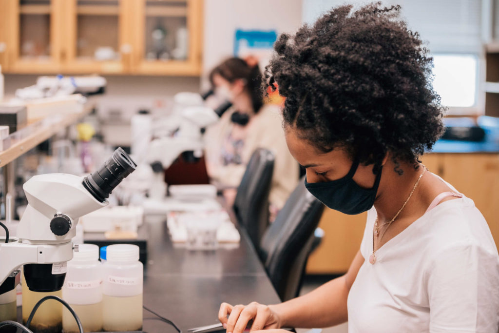Female student logging research data