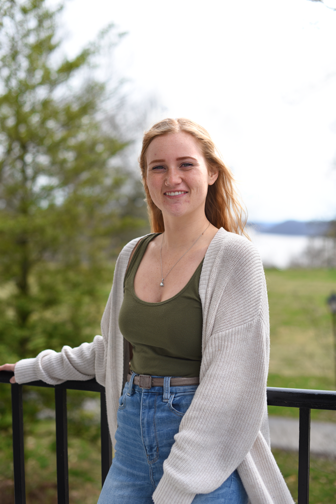 Madeline Sappenfield stands on the patio of Parker Auditorium