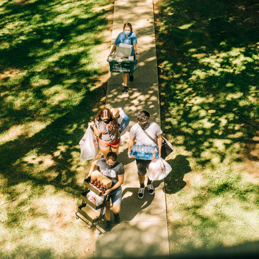 Families move students into college dorm