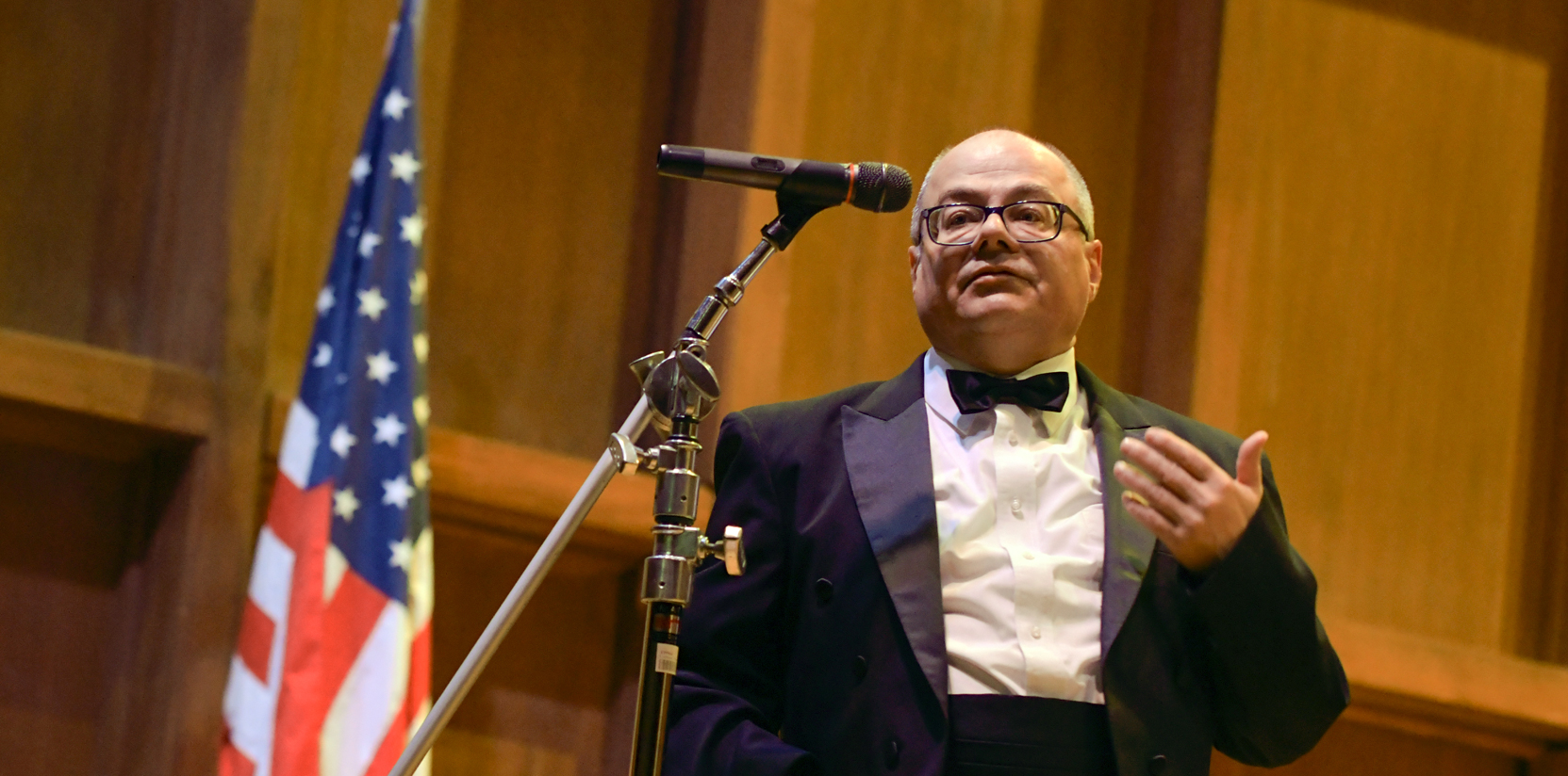 Mruzek earns honor for service to music education david mruzek professor of music wears a tuxedo and speaks into a microphone
