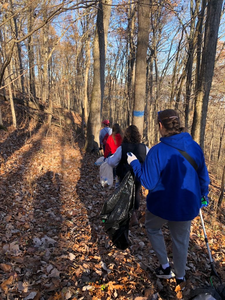 Green group hiking and collecting