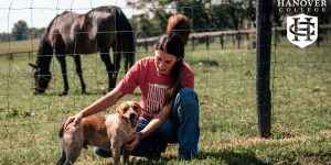 Student on farm with animals