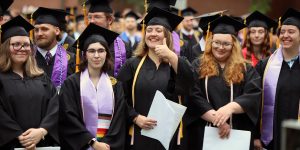 smiling students at graduation
